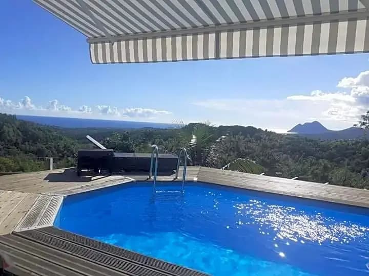 Chambre chez l'habitant avec piscine privative et vue panoramique sur la mer des cara¿s - Miniature 6